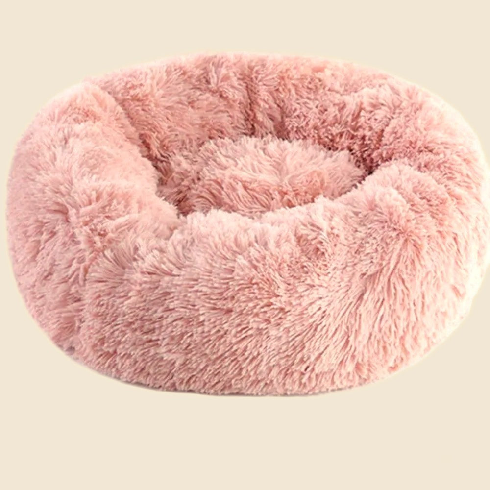 Denwell plush donut pet bed in pink, on cream background