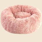 Denwell plush donut pet bed in pink, on cream background