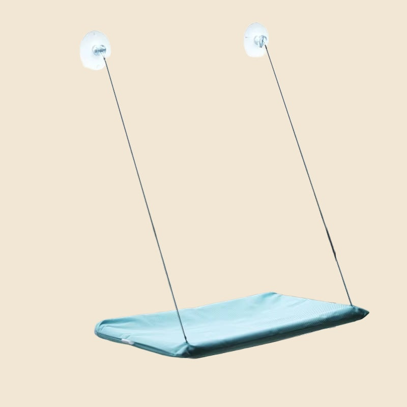 Denwell hanging cat hammock in Teal, on cream background
